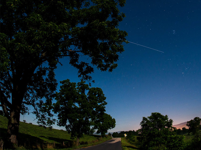 The International Space Station is seen in this 30 second exposure as it flies over Elkton, VA early in the morning, Saturday, August 1, 2015. Photo Credit: NASA/Bill Ingalls